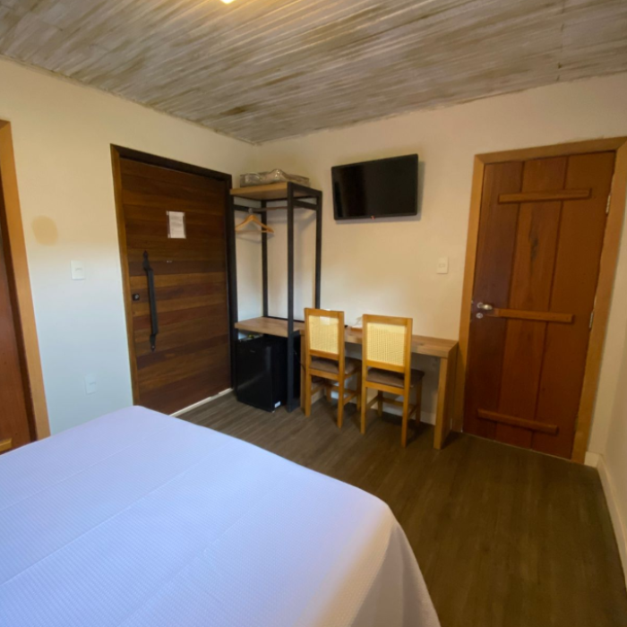 suíte com varanda e cama king